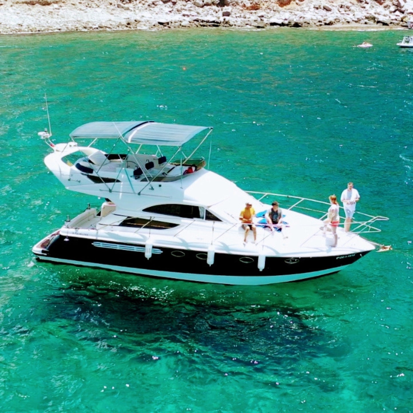 dolphin watching gran canaria - shared yacht - keeper one - blue m - passengers sunbathing