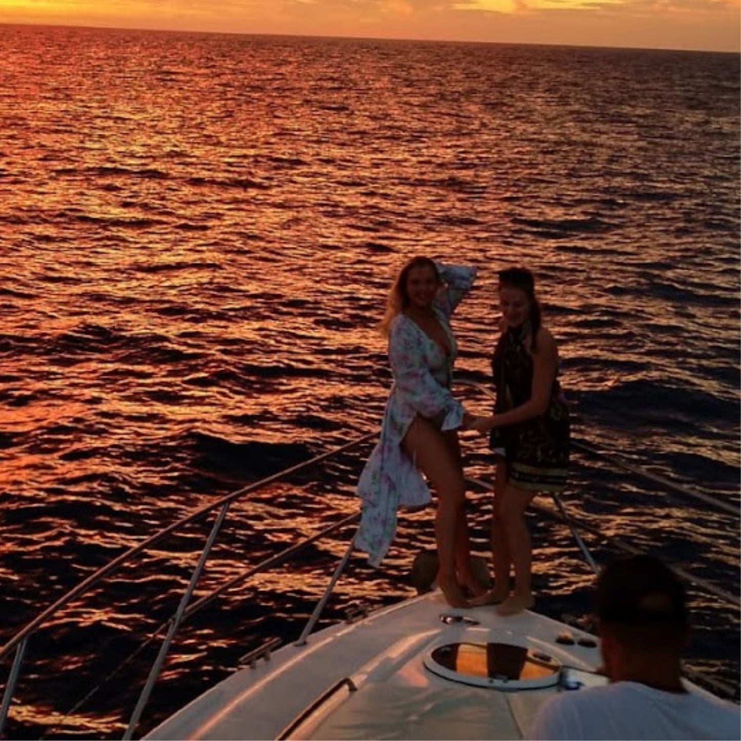 dolphin watching gran canaria - shared yacht - keeper one - blue m - enjoying the sunset